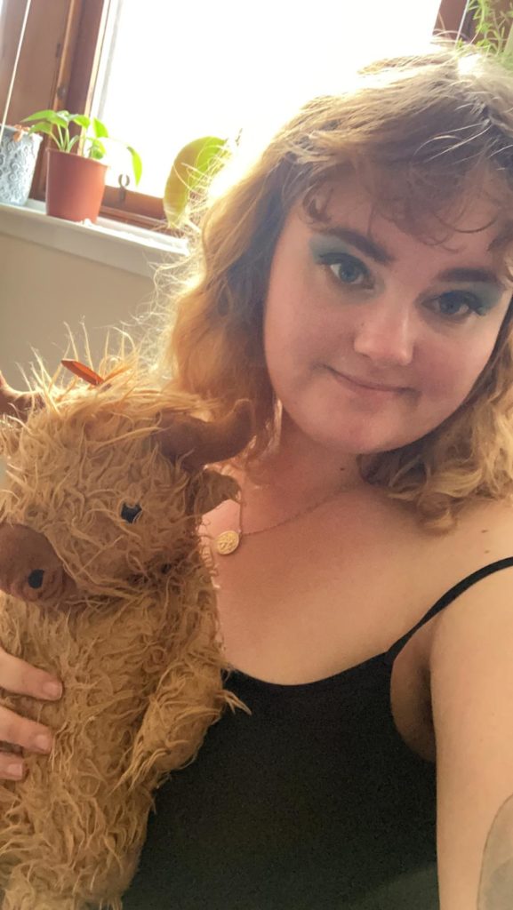 Sam did beautiful blue eye shadow for Scotland and brought out her highland cow!